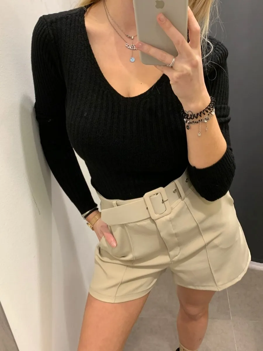 beige stretch shorts with belt